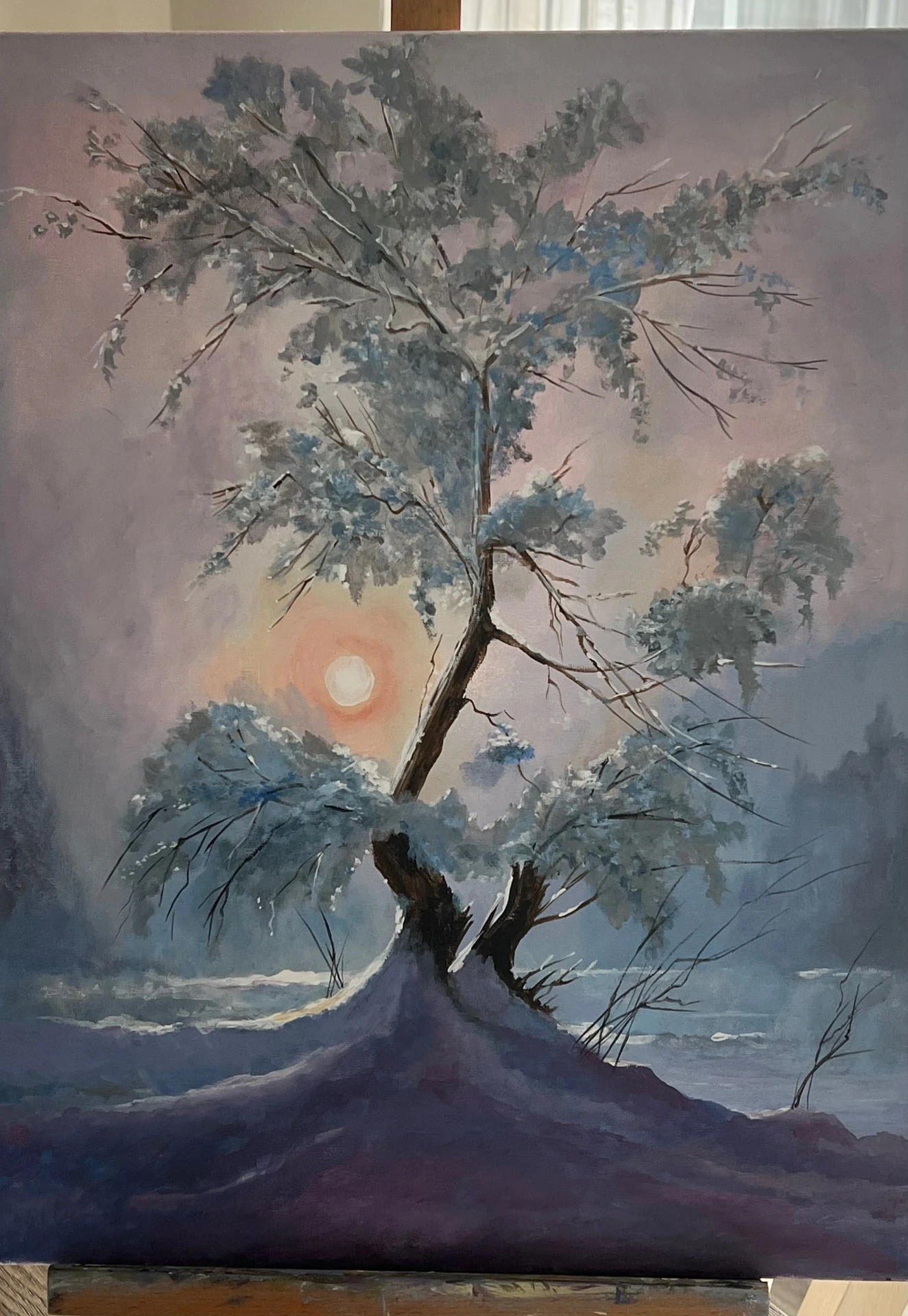 Oil painting of a solitary frost covered tree lit by a glowing sun through misty blue and purple twilight fog